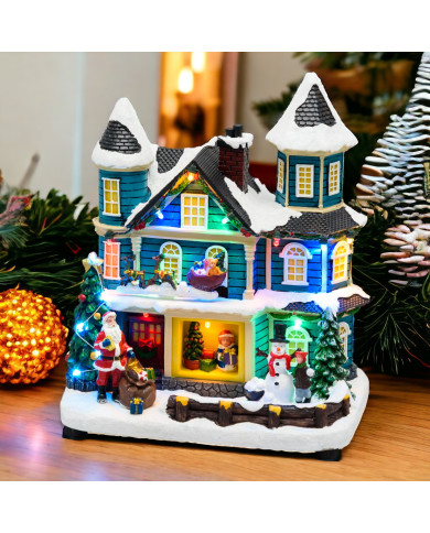 Villaggio "casa con scena natalizia", slitta in movimento oriz. e albero di natale con luci rgb 20xh.23 cm, musica e led Villaggio "casa con scena natalizia", slitta in movimento oriz. e albero di natale con luci rgb 20xh.23 cm, musica e led