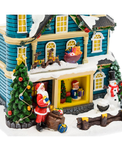 Villaggio "casa con scena natalizia", slitta in movimento oriz. e albero di natale con luci rgb 20xh.23 cm, musica e led Villaggio "casa con scena natalizia", slitta in movimento oriz. e albero di natale con luci rgb 20xh.23 cm, musica e led