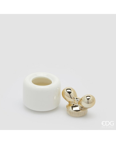 Candela fiocco con profumo, h. 10 cm, diam. 8.5 cm, prof. frangipani Candela fiocco con profumo, h. 10 cm, diam. 8.5 cm, prof. frangipani